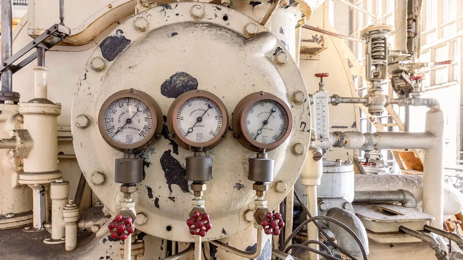 Industrial pressure gauges on a hydraulic system header