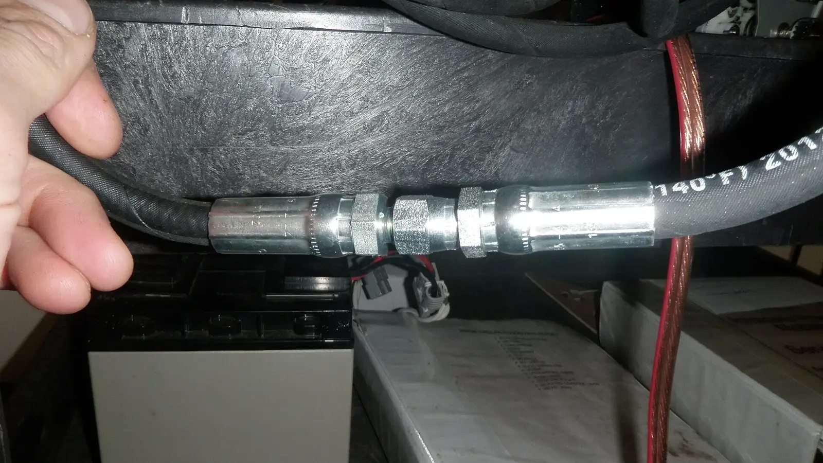 Crimped hydraulic hose ends fitted with reusable couplings
