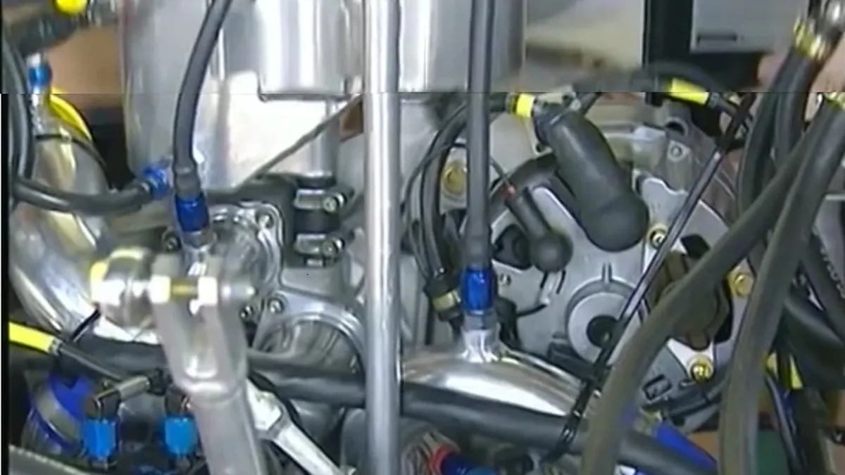 Banjo-style threaded hose fittings installed on an engine line