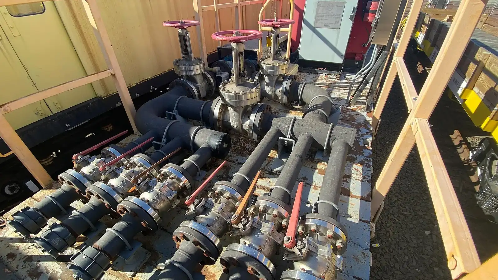 Flanged pipe section with hand-wheel valve in an outdoor plant